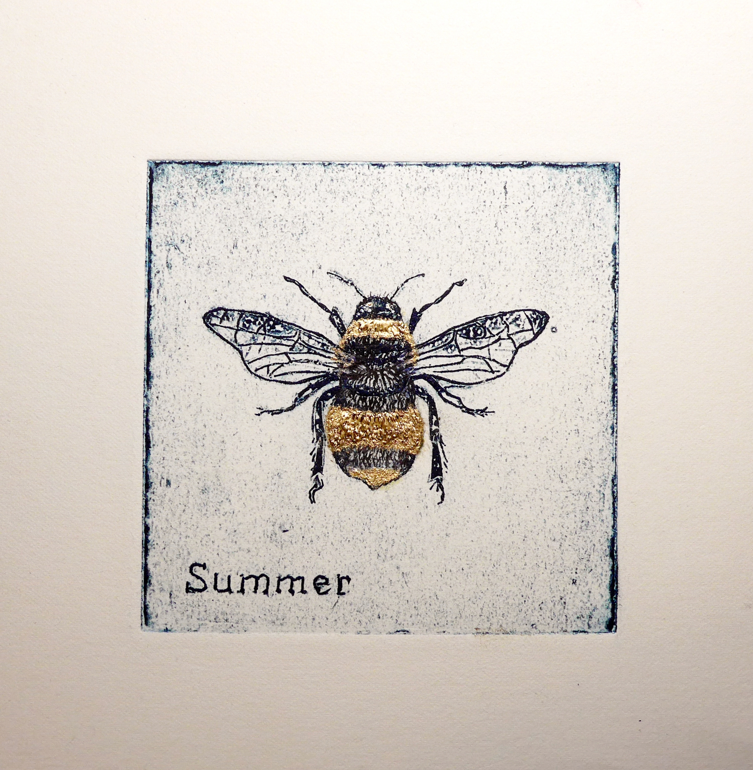 Original artwork featuring a collagraph print of a bumble bee with gold paint detail by artist Diane Young